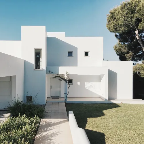a white house with a driveway in texas