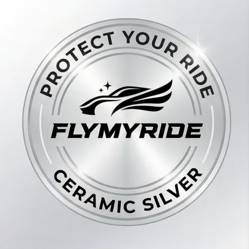 Person wearing black gloves polishing a shiny black car hood with a white cloth in a garage.