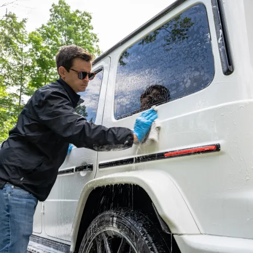 a man and a child in a white truck