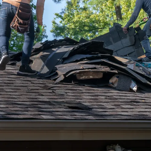 a group of people working on a roof