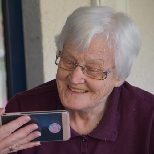 a woman holding a phone