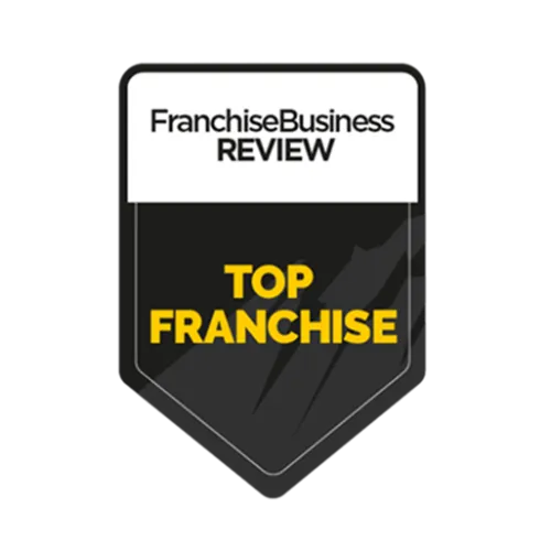 Franchise Business Review Top Franchise award badge with black and white design and yellow text.