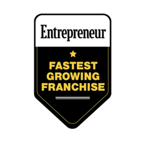 Entrepreneur badge highlighting the fastest growing franchise with a gold star on black background