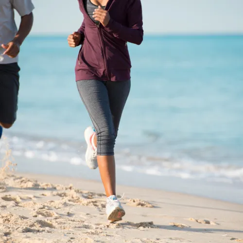 a person running on a beach