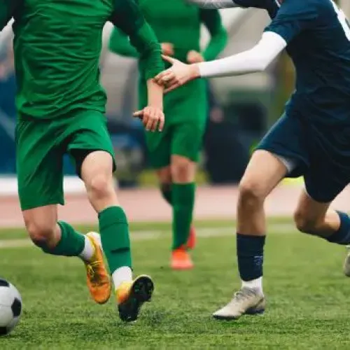 a group of men playing football