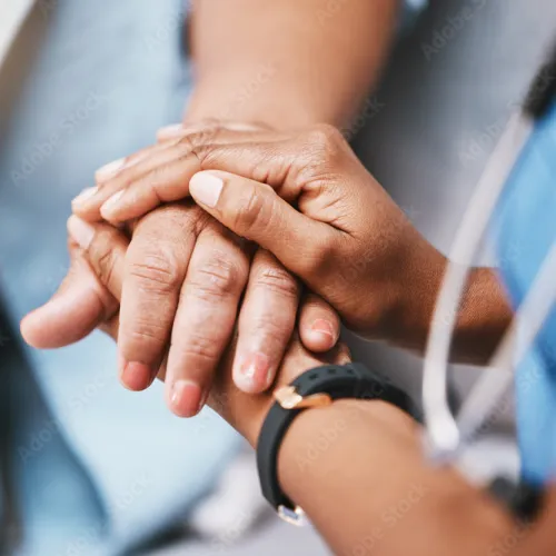 a close-up of hands clasped