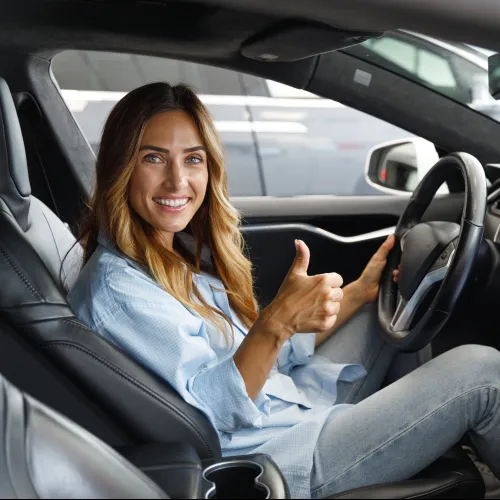 a woman sitting in a car