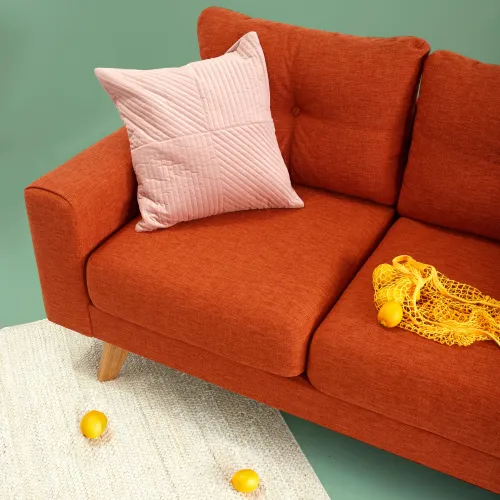 an orange sitting on top of a wooden table