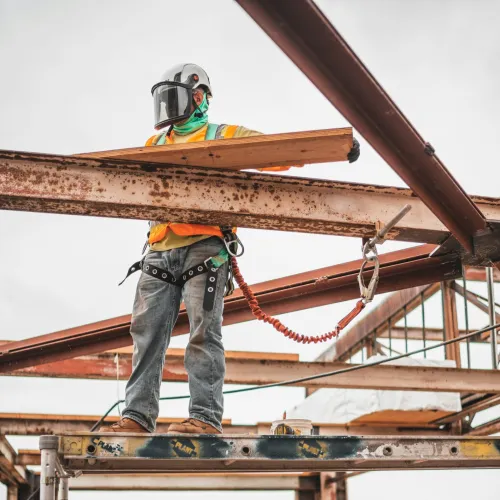 an iron worker on beams