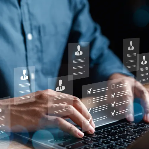 A person holding a magnifying glass in front of digital checklists and user icons, symbolizing scrutiny.