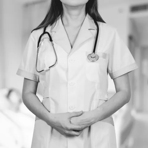 a doctor with her arms crossed