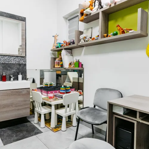 a room with a table and chairs