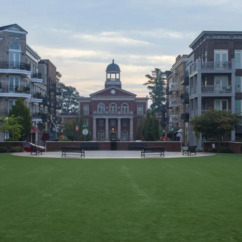 a large building with a lawn in front of it