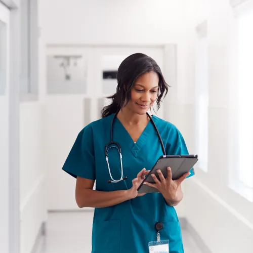 a nurse holding a tablet