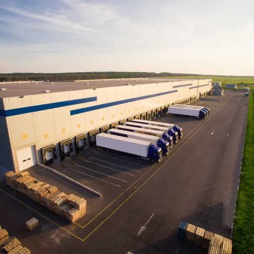 a group of trucks parked next to a building