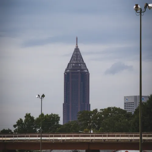 a train going by a tall building