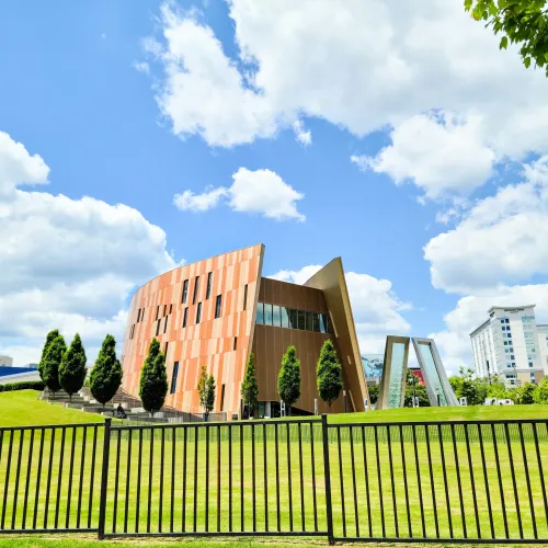 a building with a green lawn