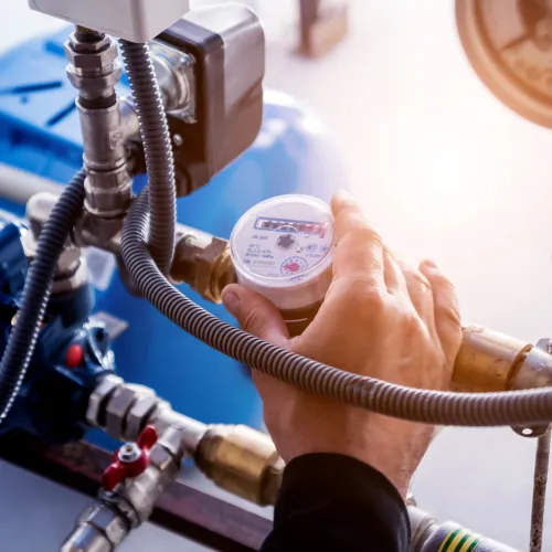 a person inspecting hvac valves