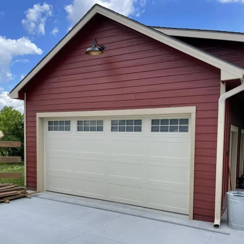 a garage door with a red roof