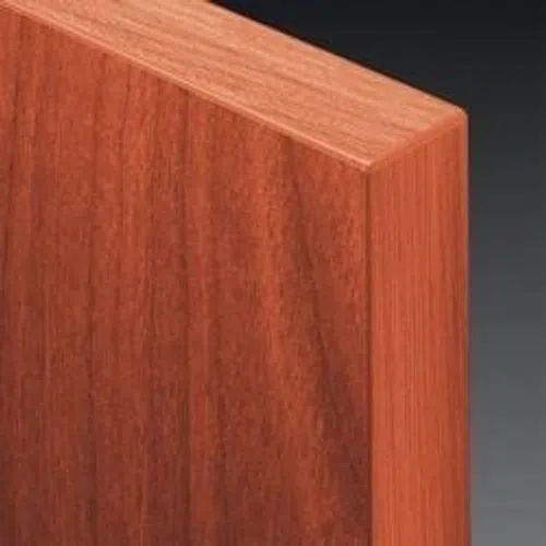 Close-up of smooth polished reddish-brown wood panel corner with visible wood grain texture.