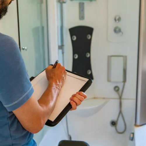 a man standing in a bathroom