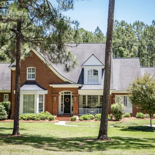 Large brick house with steep roof in Georgia, demonstrating sample reports in Athens, Atlanta, Alpharetta, Savannah areas.