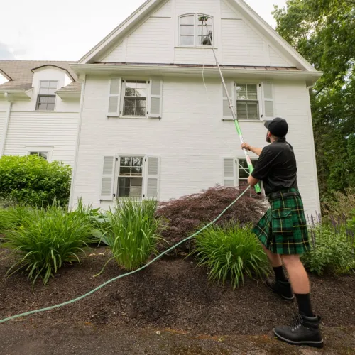 a man holding a hose