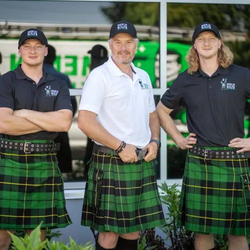 a group of men in kilts