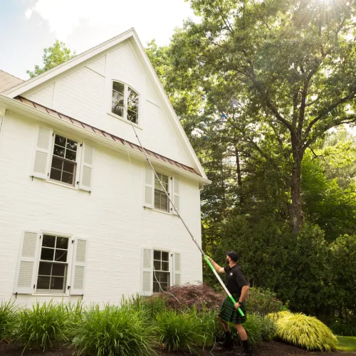 a person standing in front of a house