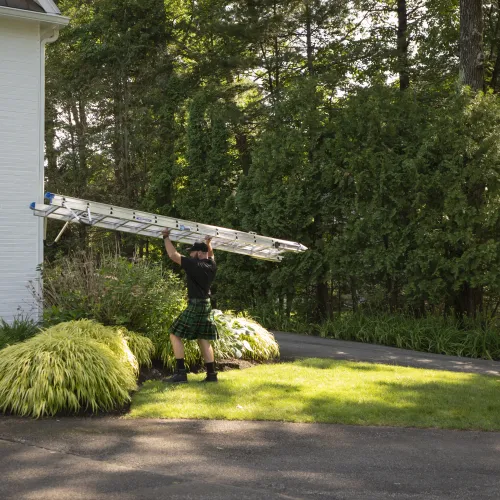 a person holding a large wooden object