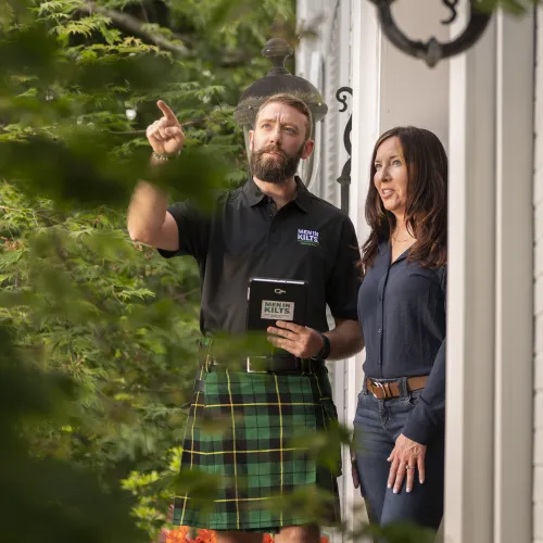 a man and a woman standing outside