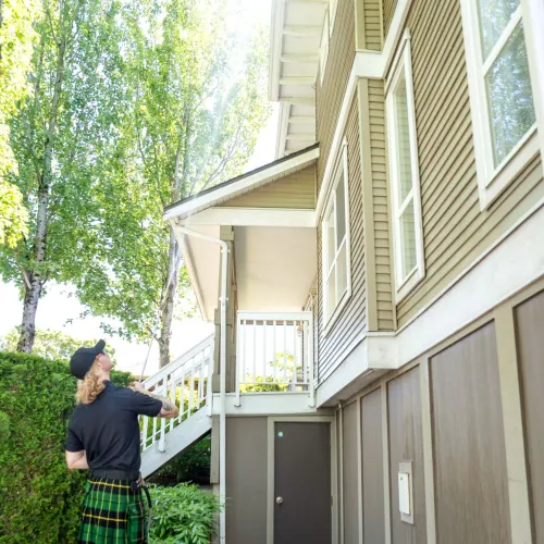 a person standing outside a house