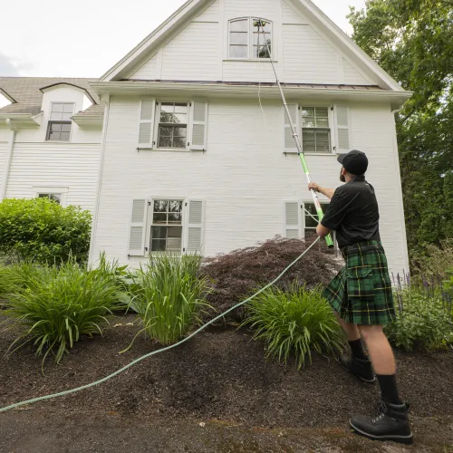 a man holding a hose