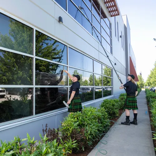 a couple of people standing outside a building