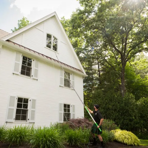 a person standing in front of a house