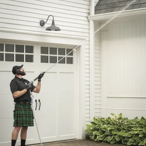 a woman wearing a kilt and holding a golf club
