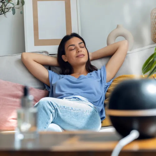 a woman sitting on a couch