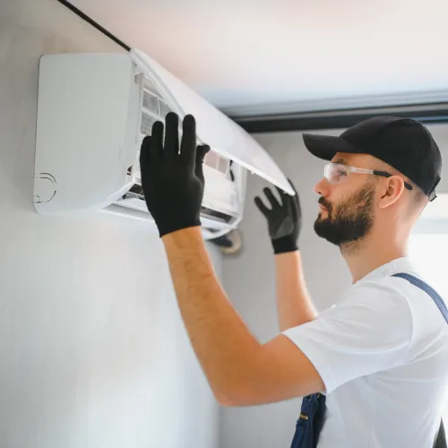 a man holding a white machine