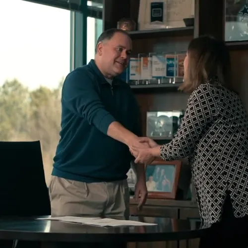 a man and a woman shaking hands