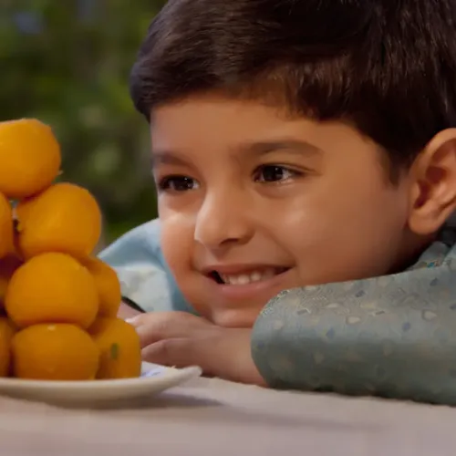 a boy smiling at the camera