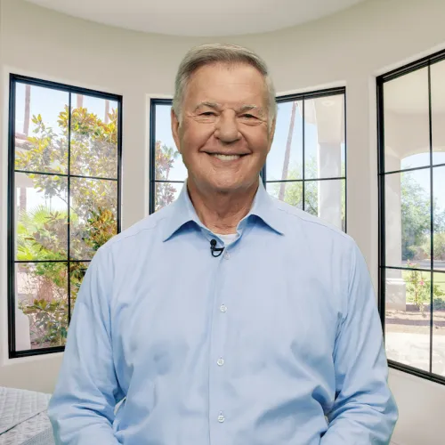 Glenn Burns standing in front of Infinity from Marvin windows
