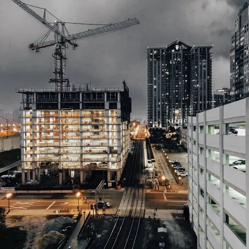a crane next to a building