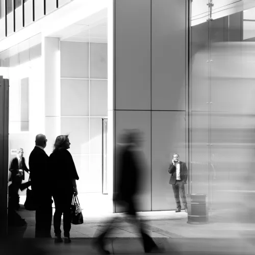 a group of people standing in a lobby