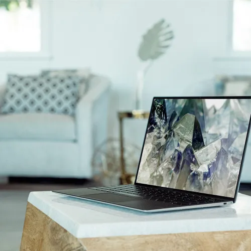 a laptop computer sitting on top of a table