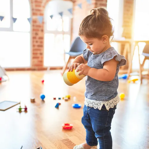 a child holding a ball