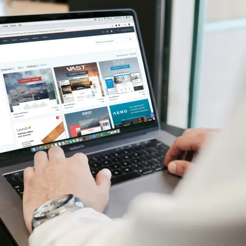 a person typing on a laptop