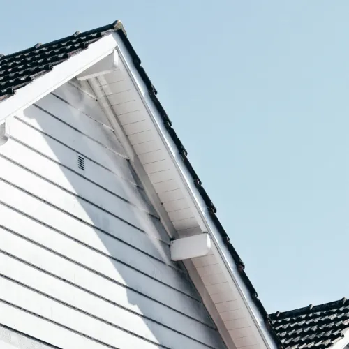 a white house with a black roof