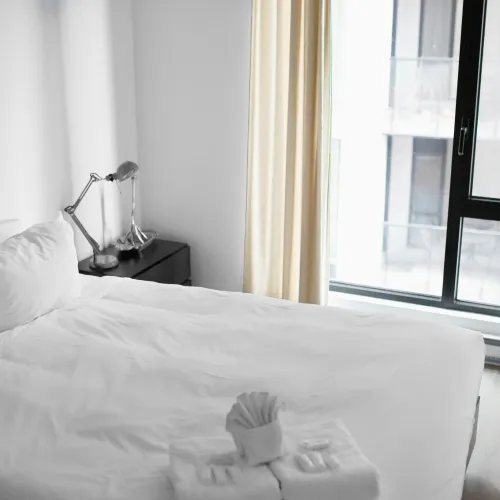 a bed with white sheets
