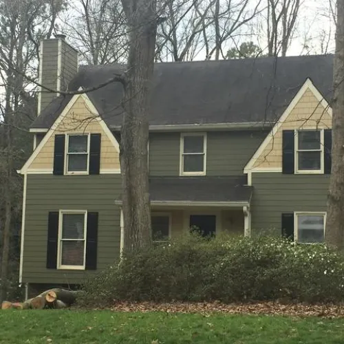The front view of a house with trees outside