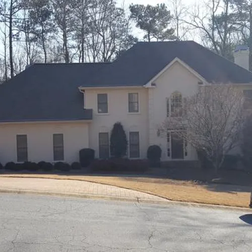a car parked in front of a house